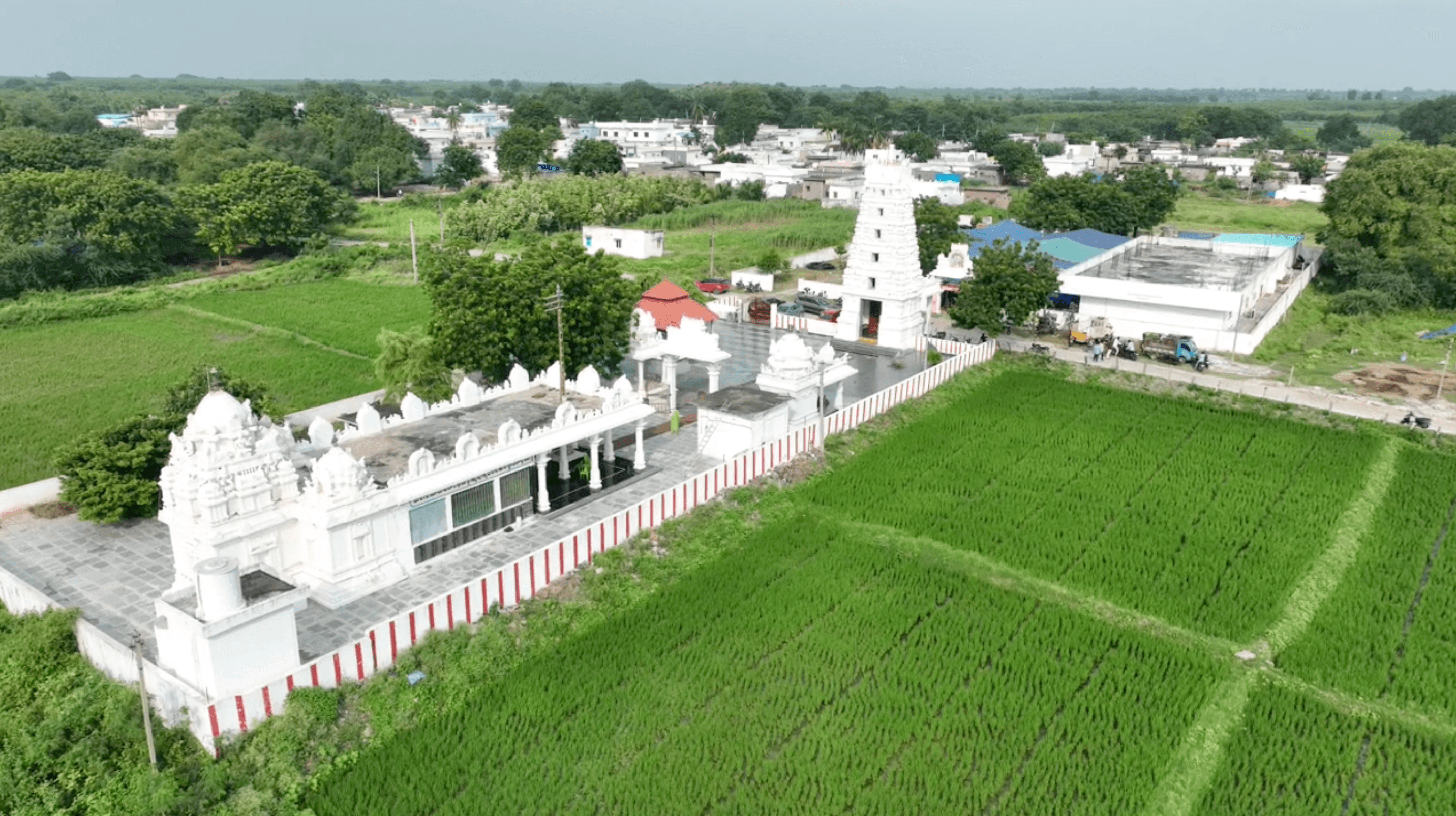 Overhead aerial view of the Devasthanam surrounded by green fields